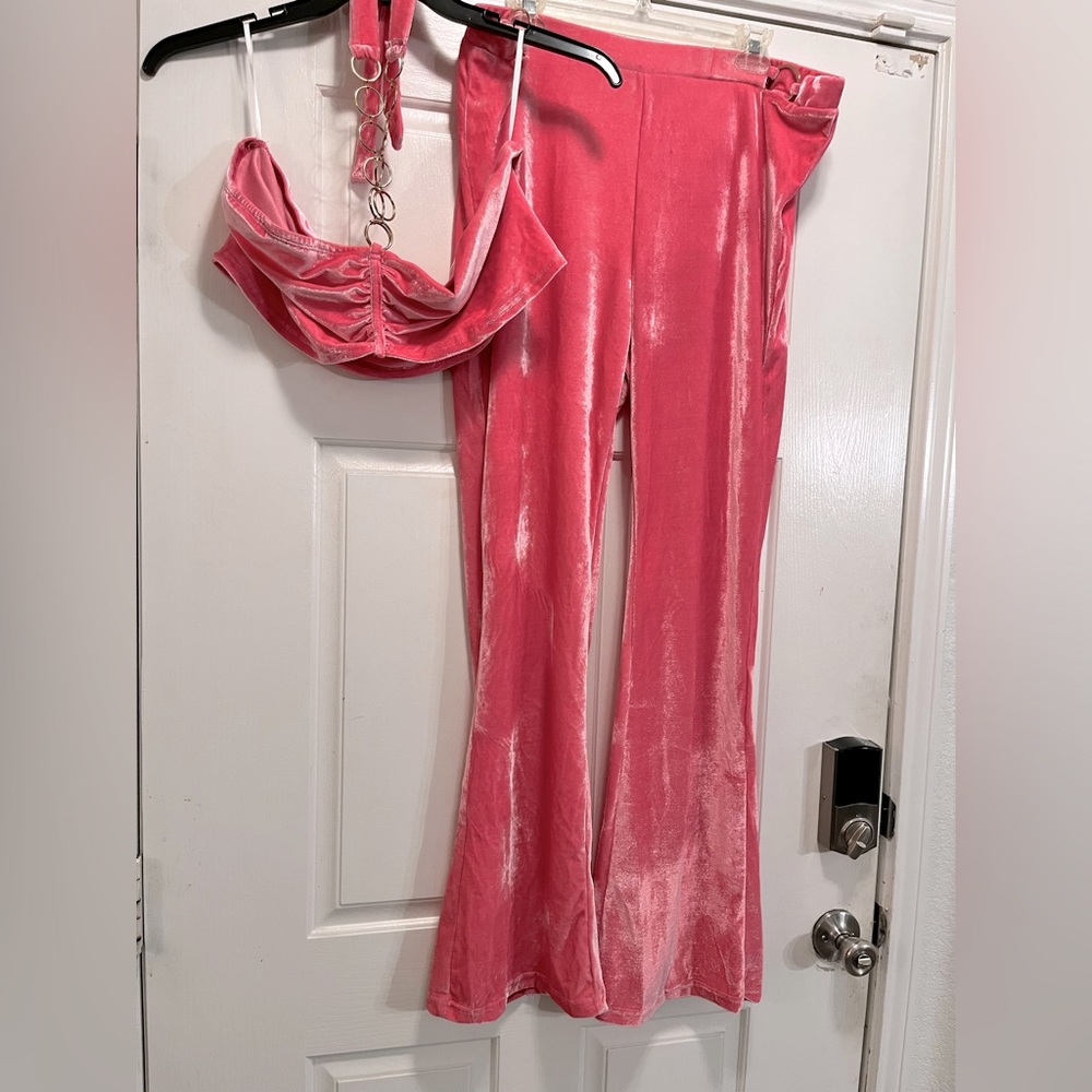 Pink velvety material, light,comfortable. Halter style, gold metal accents